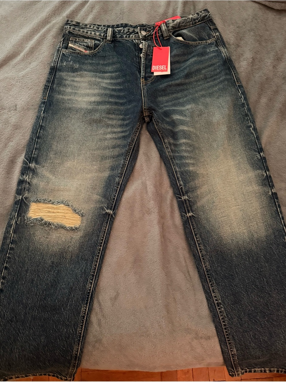 Diesel Men's Washed Blue Relaxed Jeans with Distressed Knee